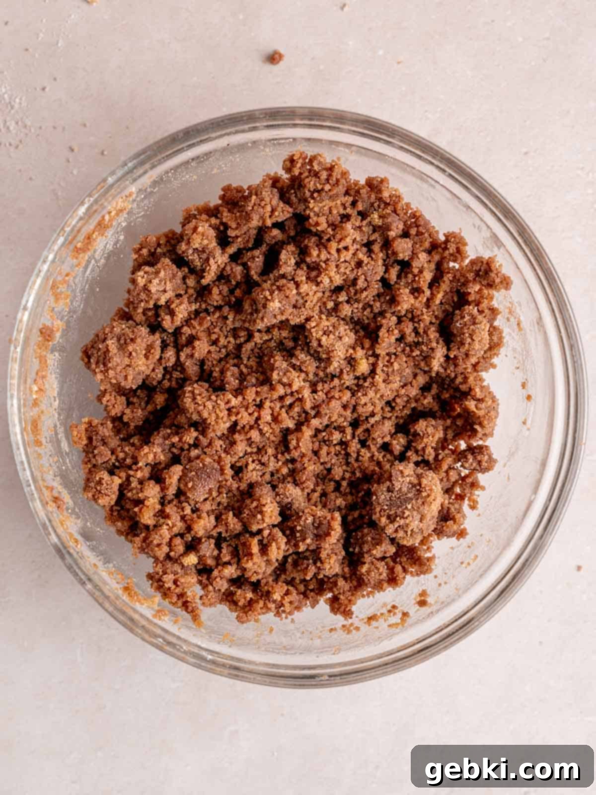 Espresso Muffins with Chocolate Streusel 4 Crumb topping with cocoa powder in a bowl, ready to be sprinkled.