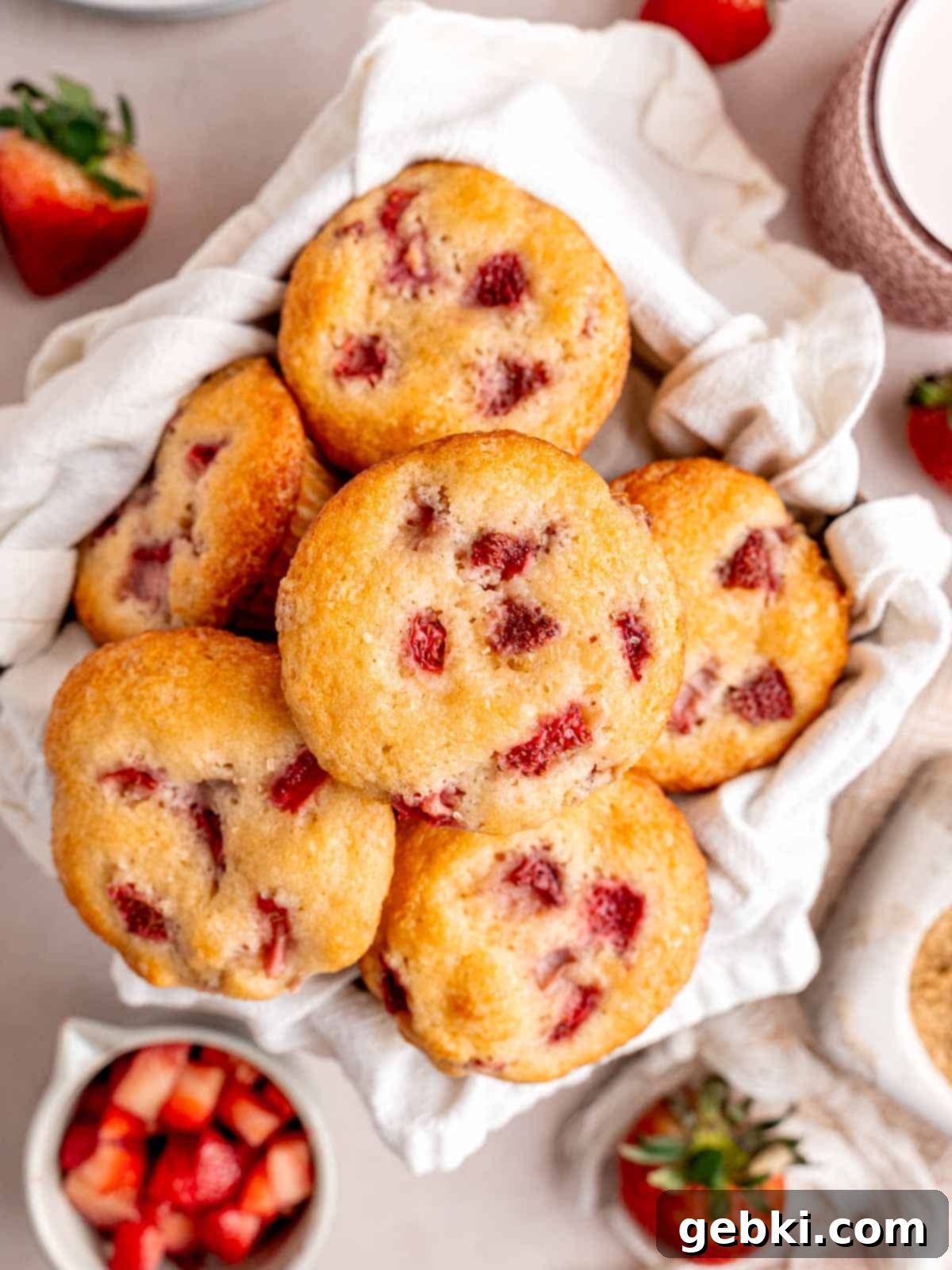 Quick and Easy Strawberry Muffins 2 Top view of strawberry muffins in a basket.