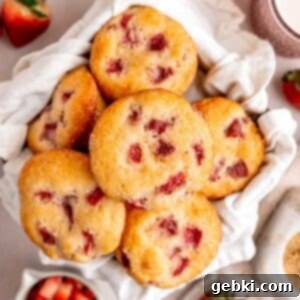 Quick and Easy Strawberry Muffins 12 Strawberry muffins in a basket.