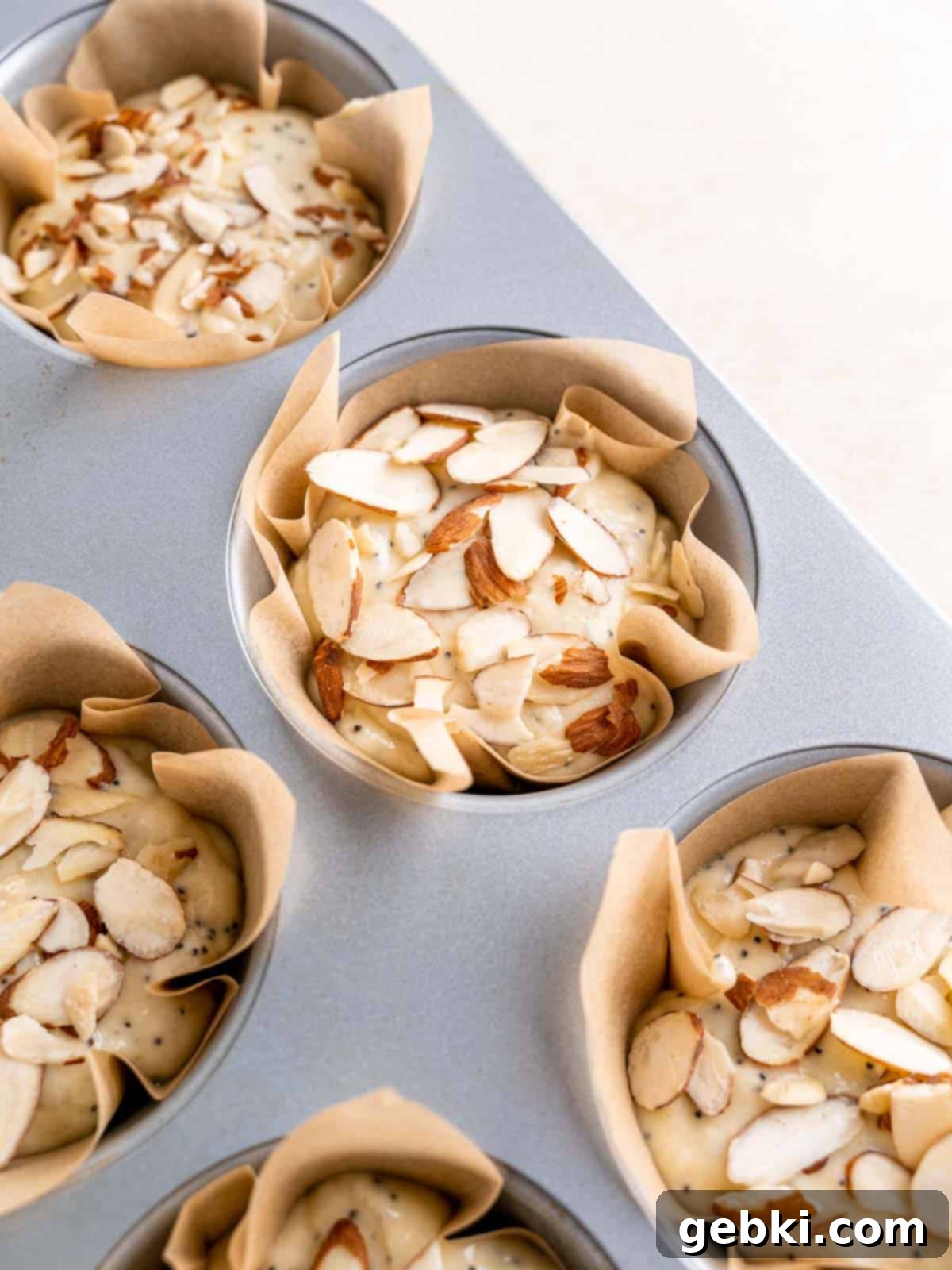 The Ultimate Guide To Homemade Muffin Liners 2 DIY muffin liners filled with almond poppy seed batter.