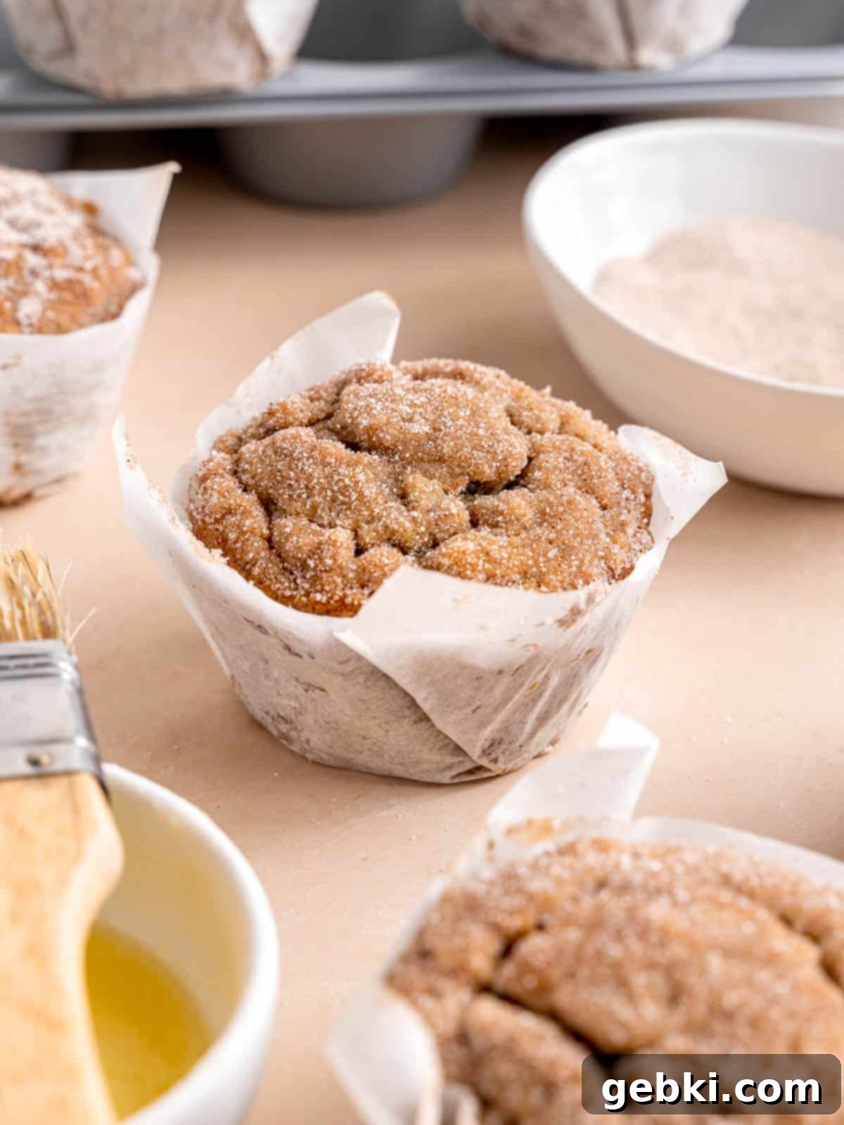The Ultimate Guide To Homemade Muffin Liners 13 A banana bread muffin with cinnamon sugar topping.