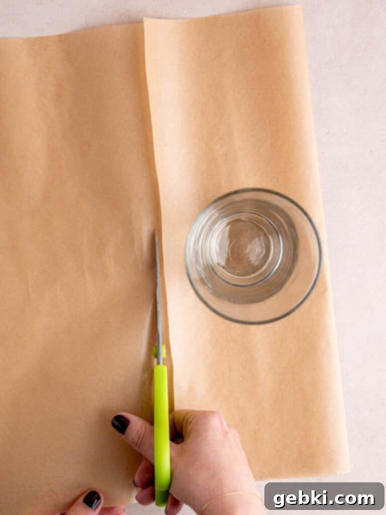 The Ultimate Guide To Homemade Muffin Liners 5 Cutting parchment paper to make cupcake liners.