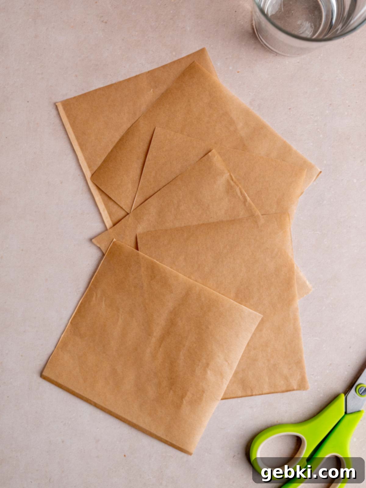 The Ultimate Guide To Homemade Muffin Liners 7 Parchment paper cut into 6 equal squares.