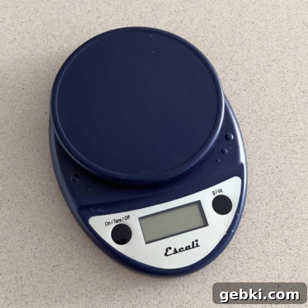 Close-up of an Escali food scale displaying a measurement, emphasizing precision in baking.