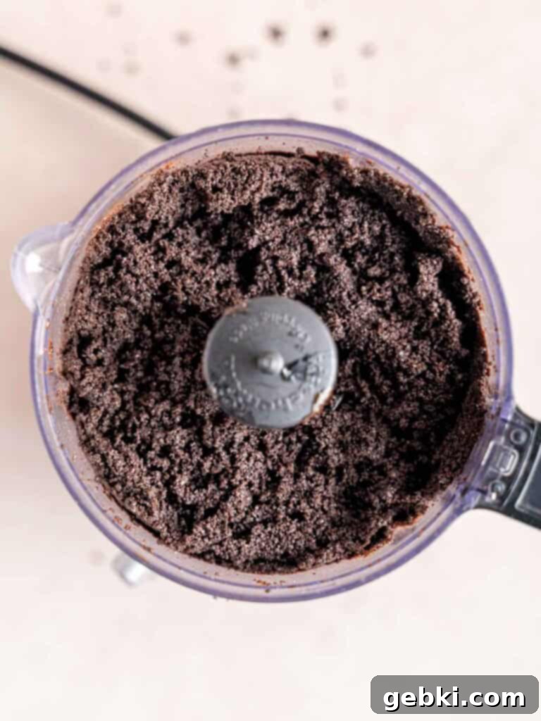 Crushed Oreo cookies and melted butter in a food processor.