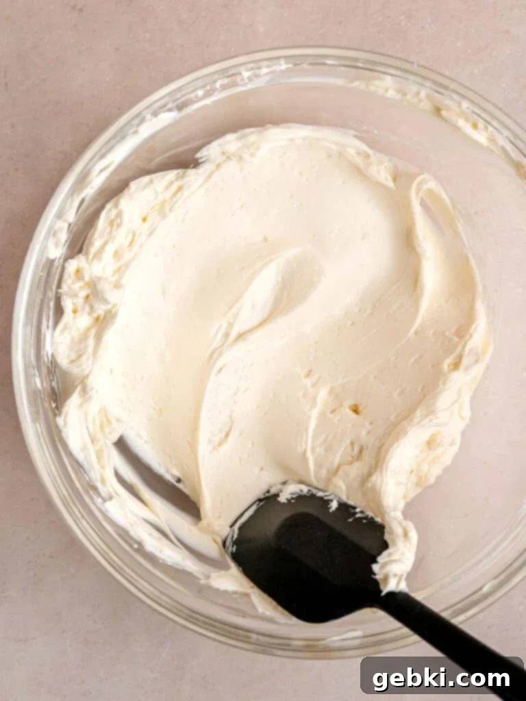 Smooth softened cream cheese in a bowl.