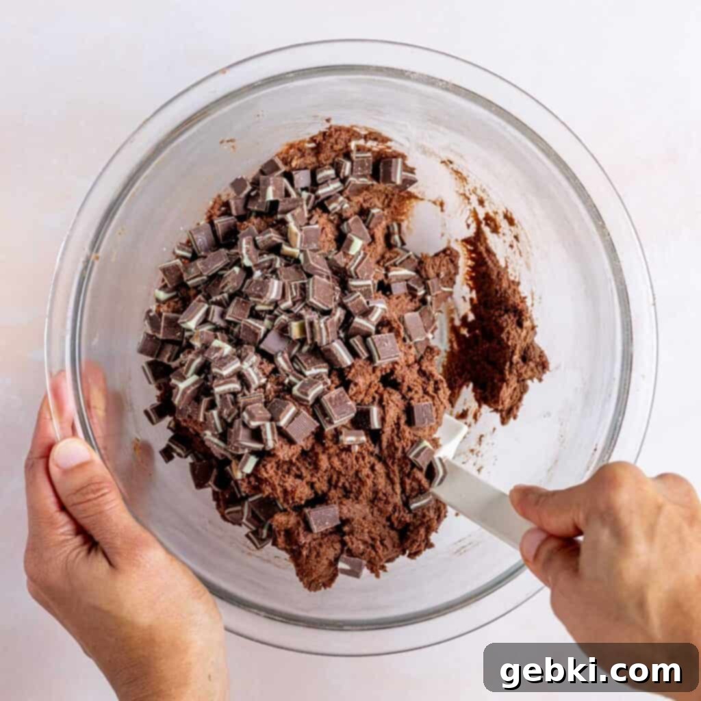 Irresistible Chewy Andes Mint Chocolate Cookies 6 Folding chopped Andes mints into chocolate cookie dough.