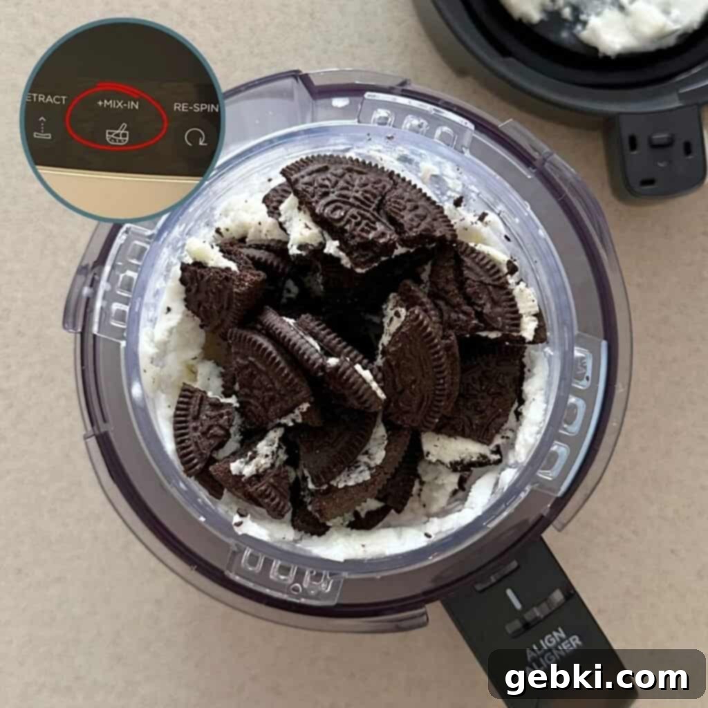 Simple Ninja Creami Cookies and Cream Kefir Ice Cream 8 Crushed Oreo cookies in a Ninja Creami pint of kefir vanilla ice cream.