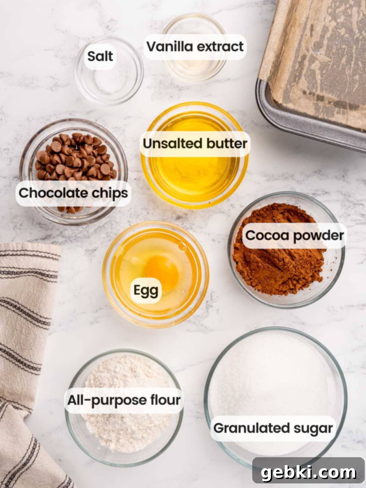 Ingredients needed to make small batch brownies in a loaf pan.