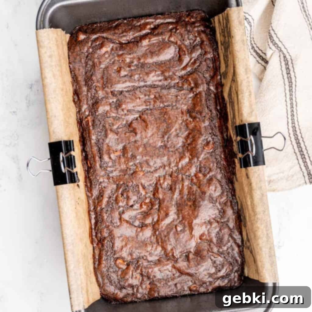 Loaf pan brownies with shiny, crinkly tops.