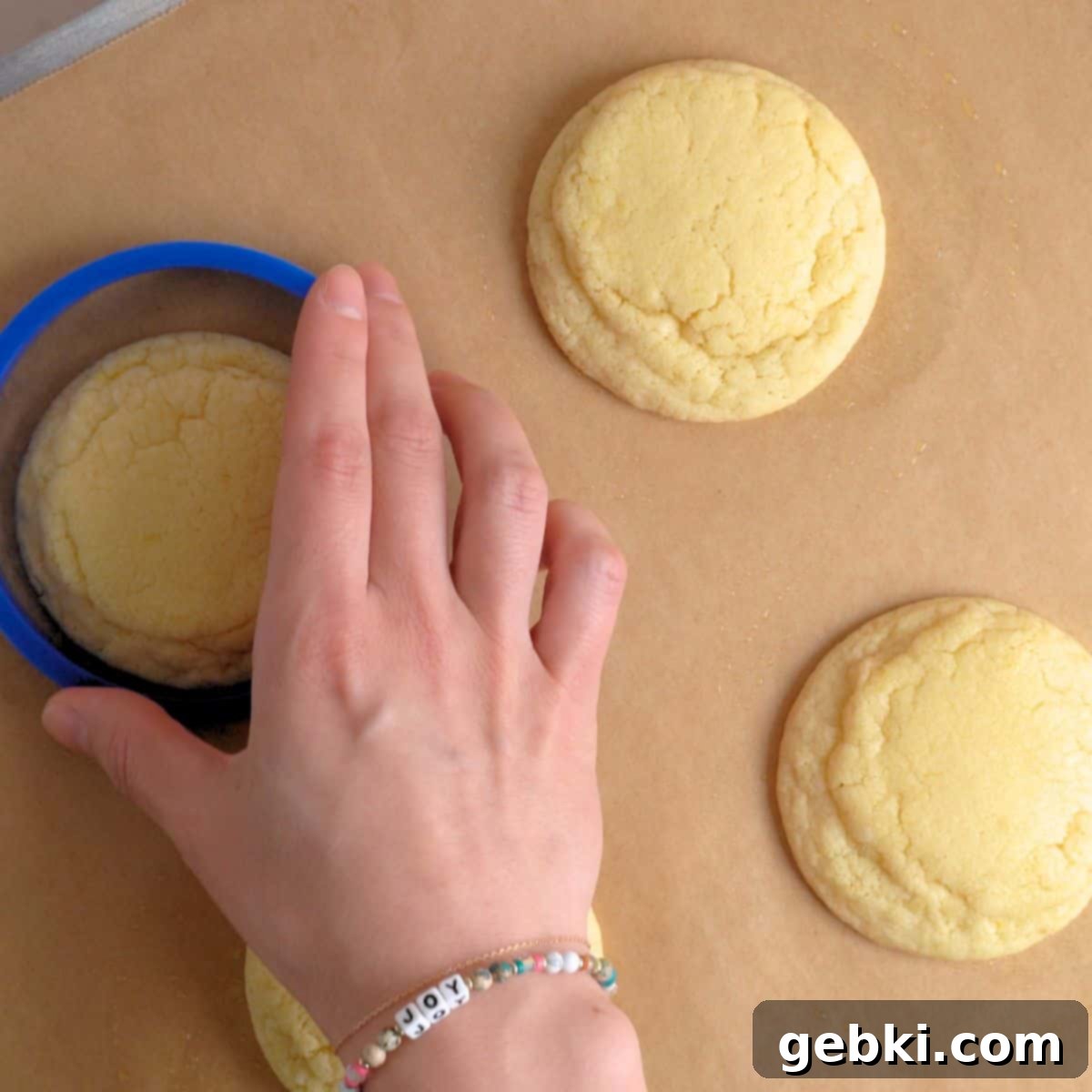 Scooting baked sugar cookies with lemon fresh out of the oven.