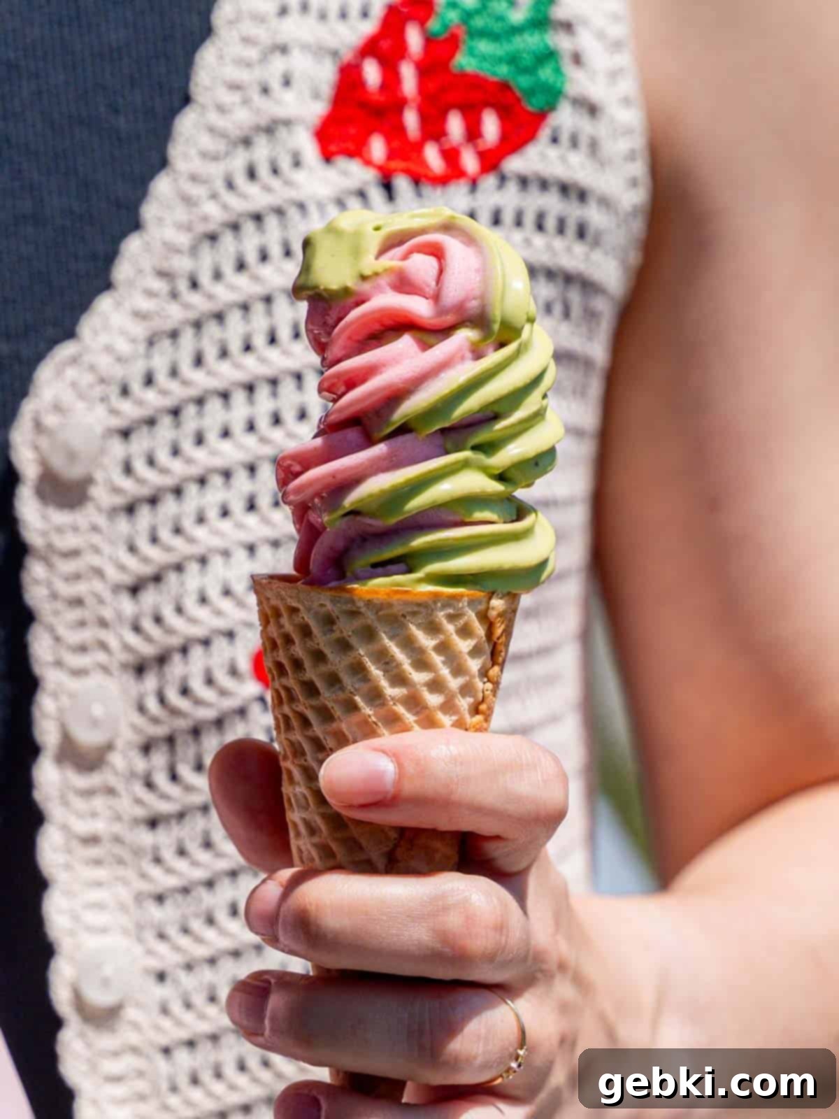 Strawberry Matcha Ninja Creami Treat 2 Strawberry matcha ice cream swirled in a sugar cone.
