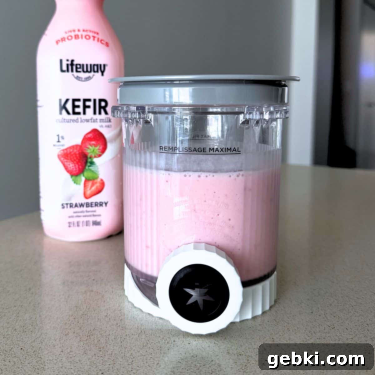 Strawberry Matcha Ninja Creami Treat 5 A mixture of strawberries, sugar, and Lifeway strawberry kefir in a Ninja Creami pint.