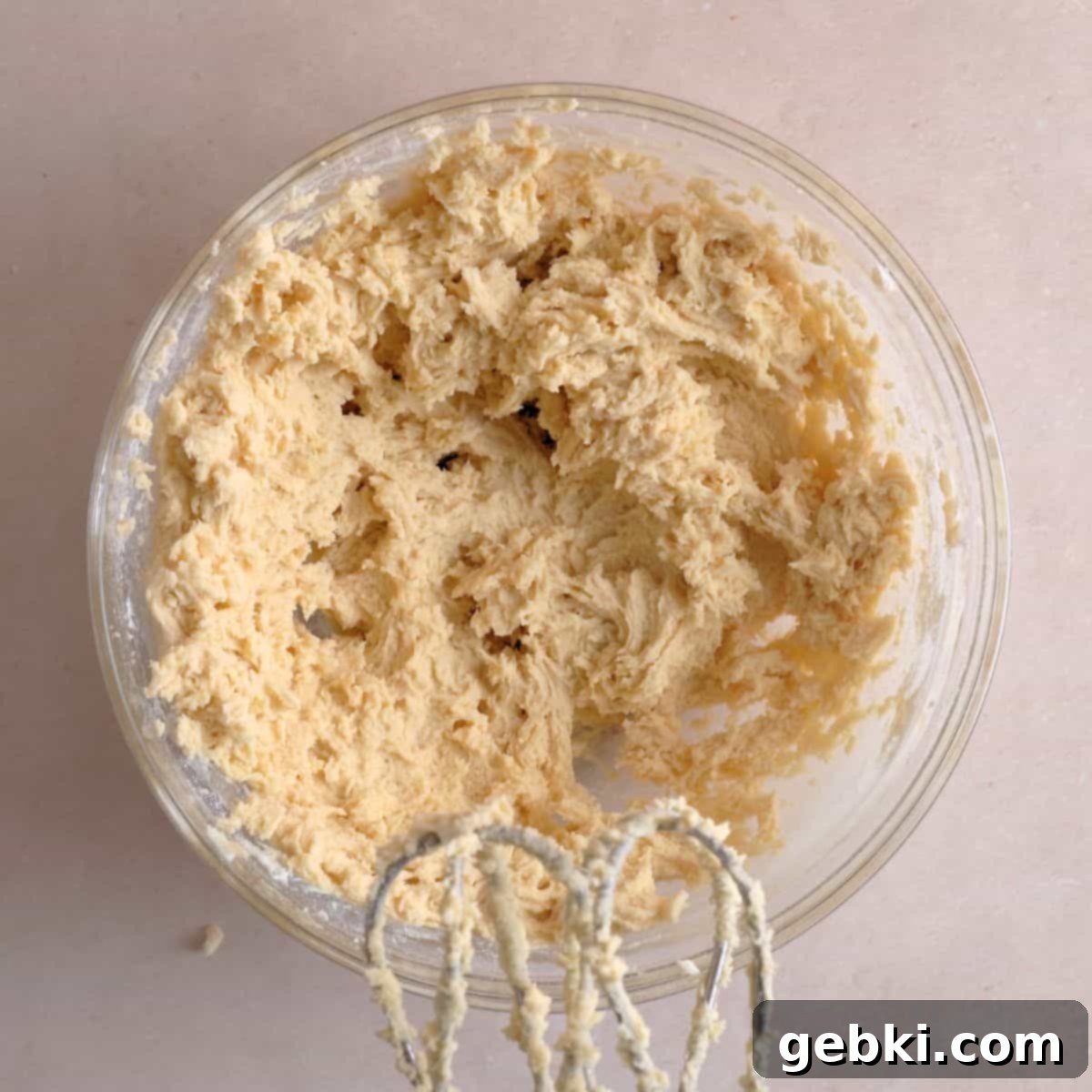 Irresistible Chewy Salted Caramel Oat Cookies 6 Dry cookie ingredients mixed into the wet ingredients with a hand mixer.