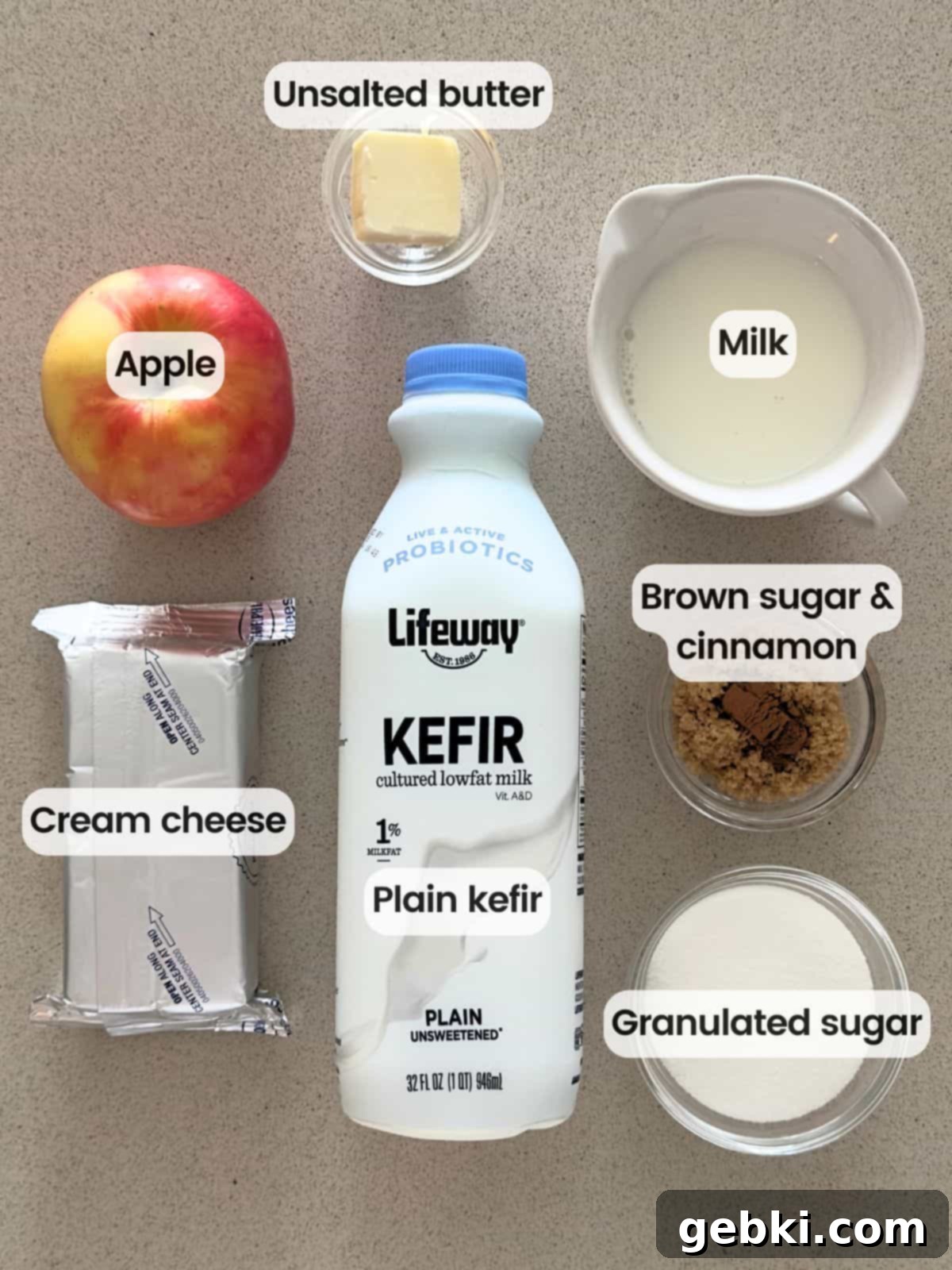 Ninja Creami Apple Pie Delight 3 Ingredients needed to make apple pie ice cream with a Ninja Creami, including cream cheese, kefir, apple, butter, brown sugar, and cinnamon.