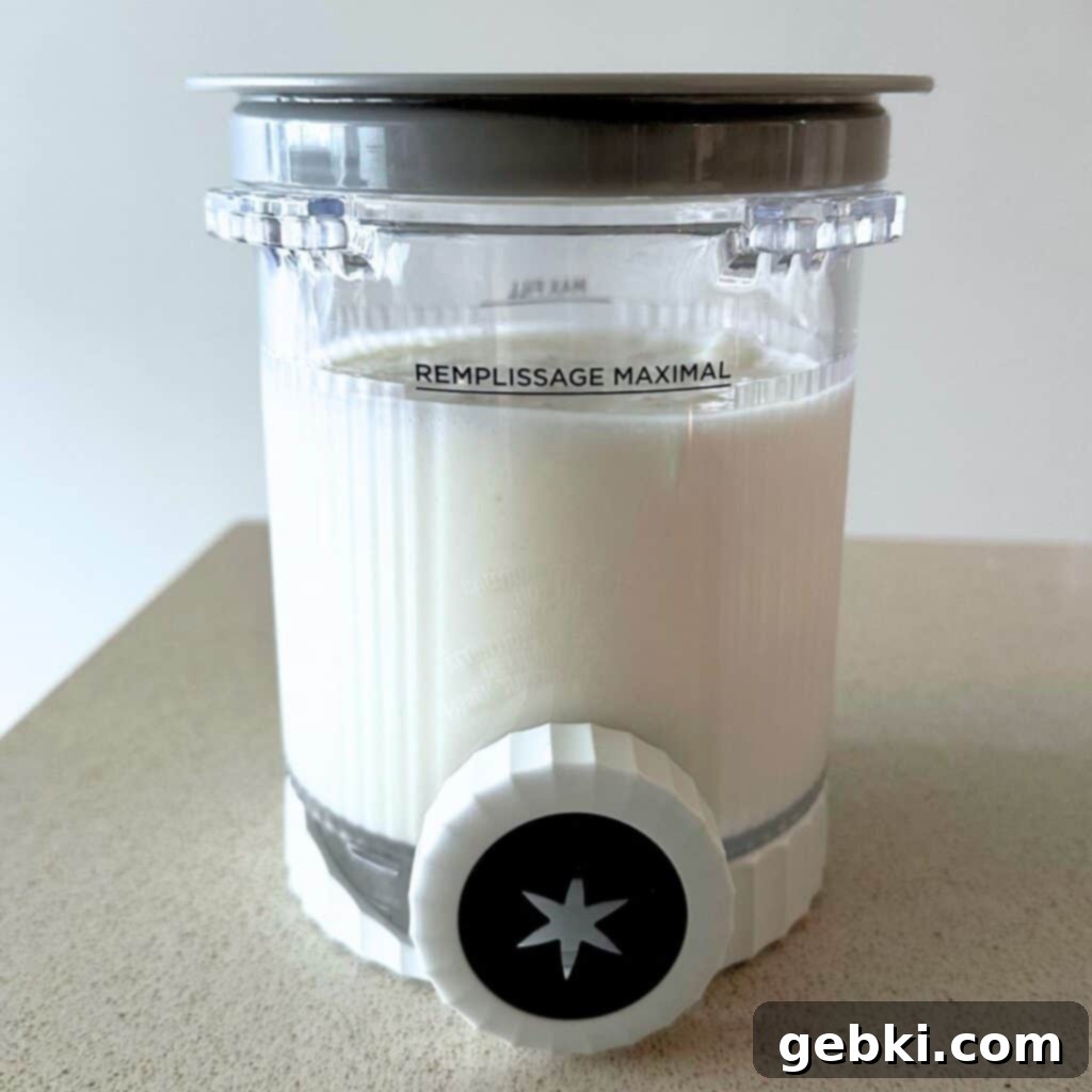 Ninja Creami Apple Pie Delight 5 Cheesecake ice cream base in a Ninja Creami pint, ready for freezing.