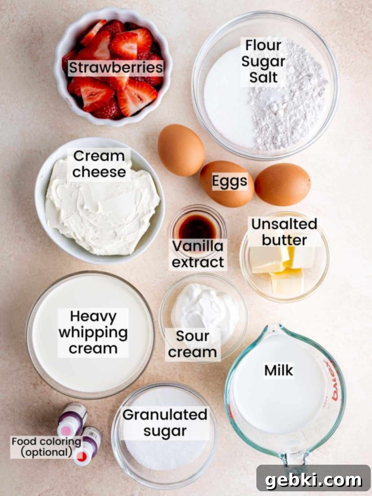 All the essential ingredients neatly arranged, ready to make a strawberry crepe cake with its luscious cream cheese filling.