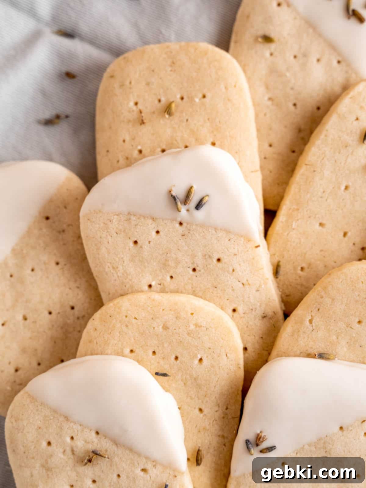 Lavender shortbread cookies layered on top of each other.