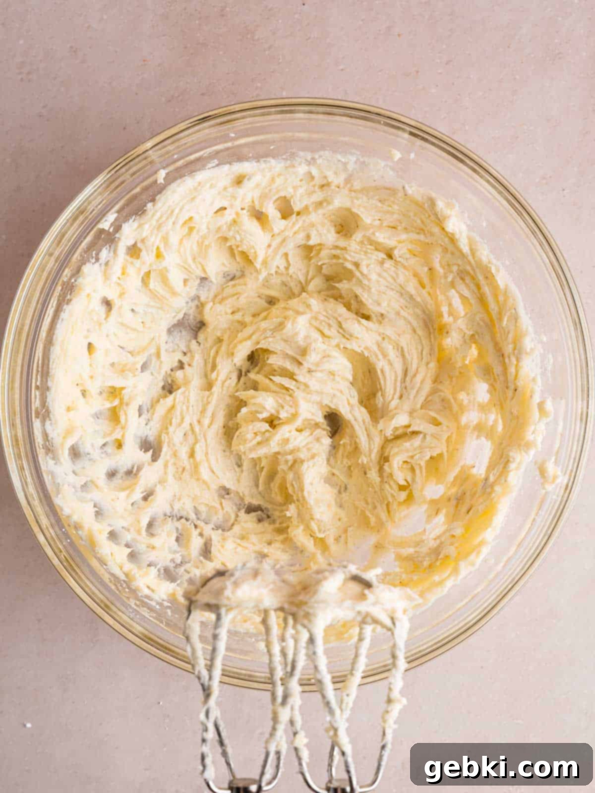 Butter, sugar, and ground dried lavender mixed together in a bowl.
