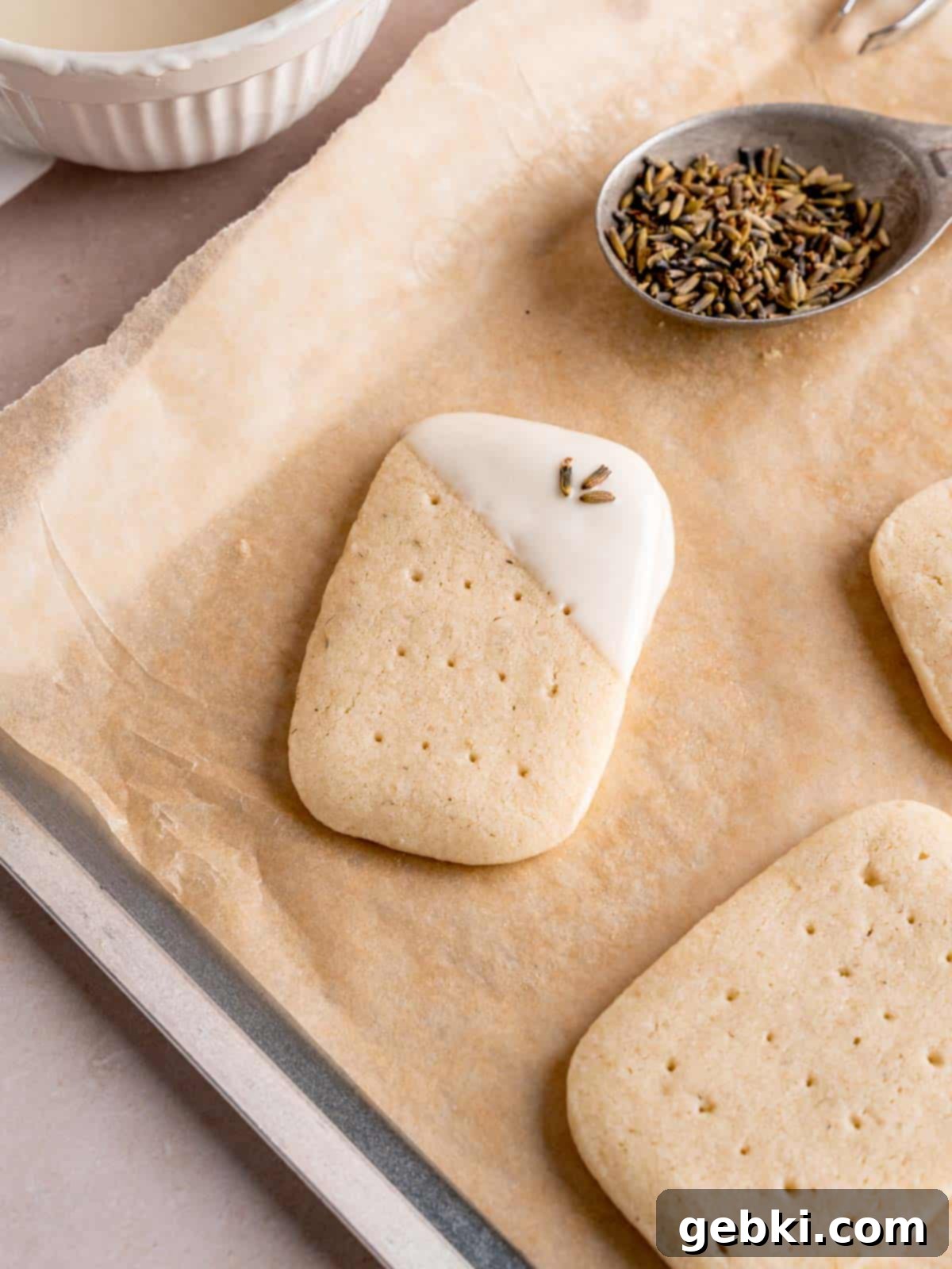 A lavender shortbread cookie dipped in melted white chocolate.