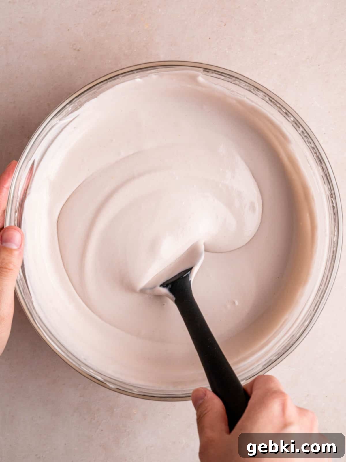 Lavender Honey Dream 6 Mixing whipped cream into a lavender honey ice cream mixture.