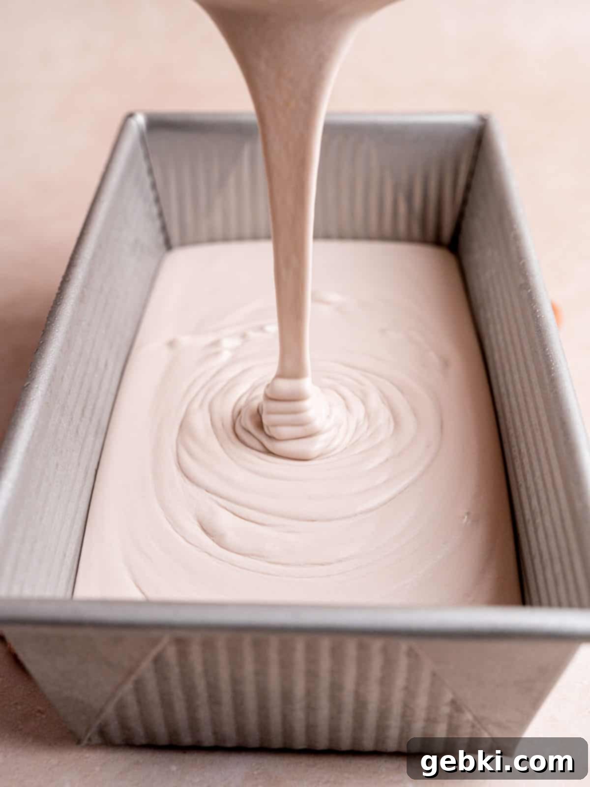 Lavender Honey Dream 7 Pouring honey lavender ice cream mixture into a cold loaf pan.
