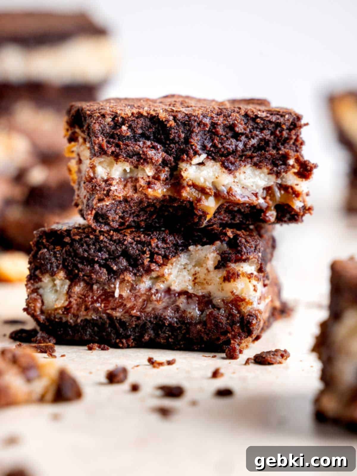 Samoa Caramel Coconut Brownies 6 Two samoa brownies stacked on each other.