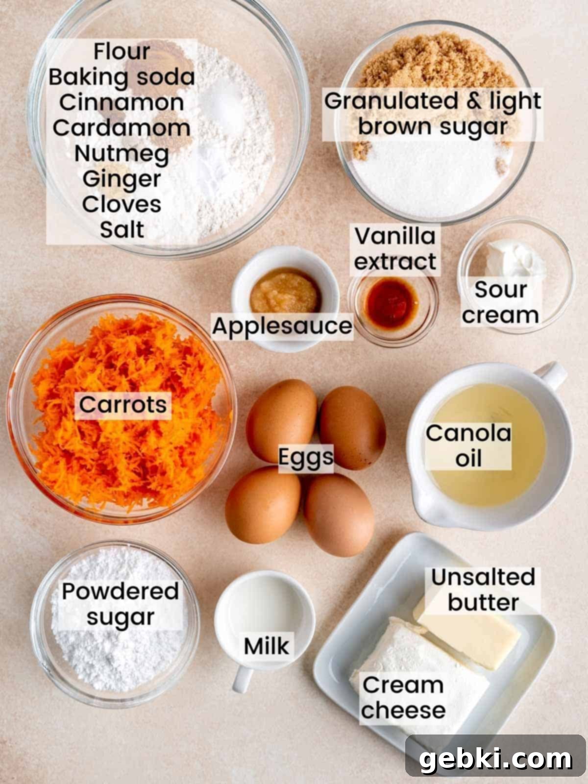 Ingredients laid out for carrot cake French toast including sugar, flour, spices, eggs, and carrots.