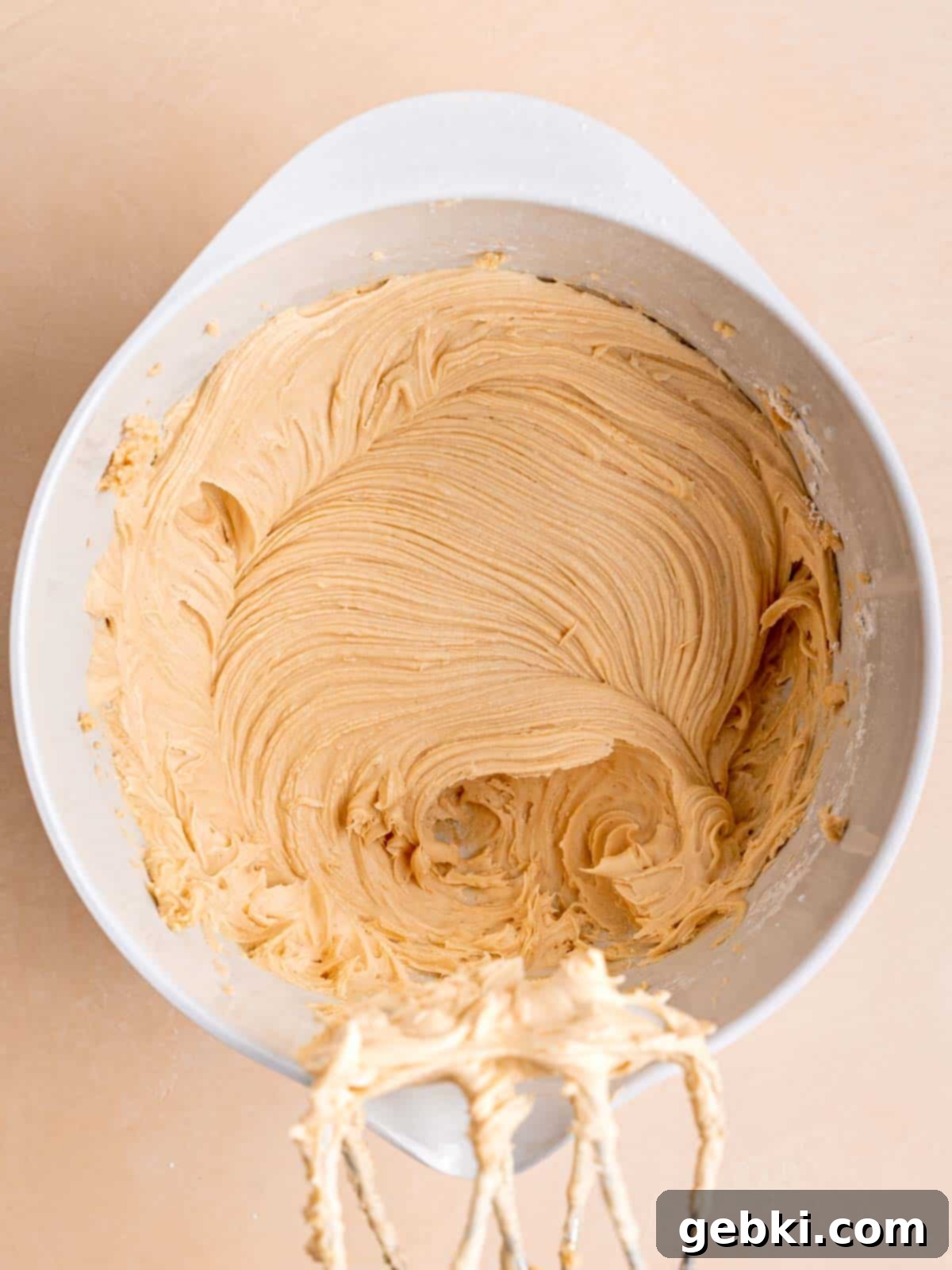 The Easiest Frosted Banana Cake Ever 7 Peanut butter and honey buttercream mixed in a bowl.