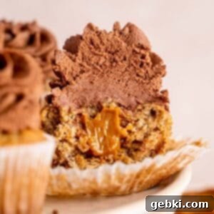 Banoffee Bliss Cupcakes 13 Half of a banoffee cupcake showing the dulce de leche filling and chocolate ganache topping.