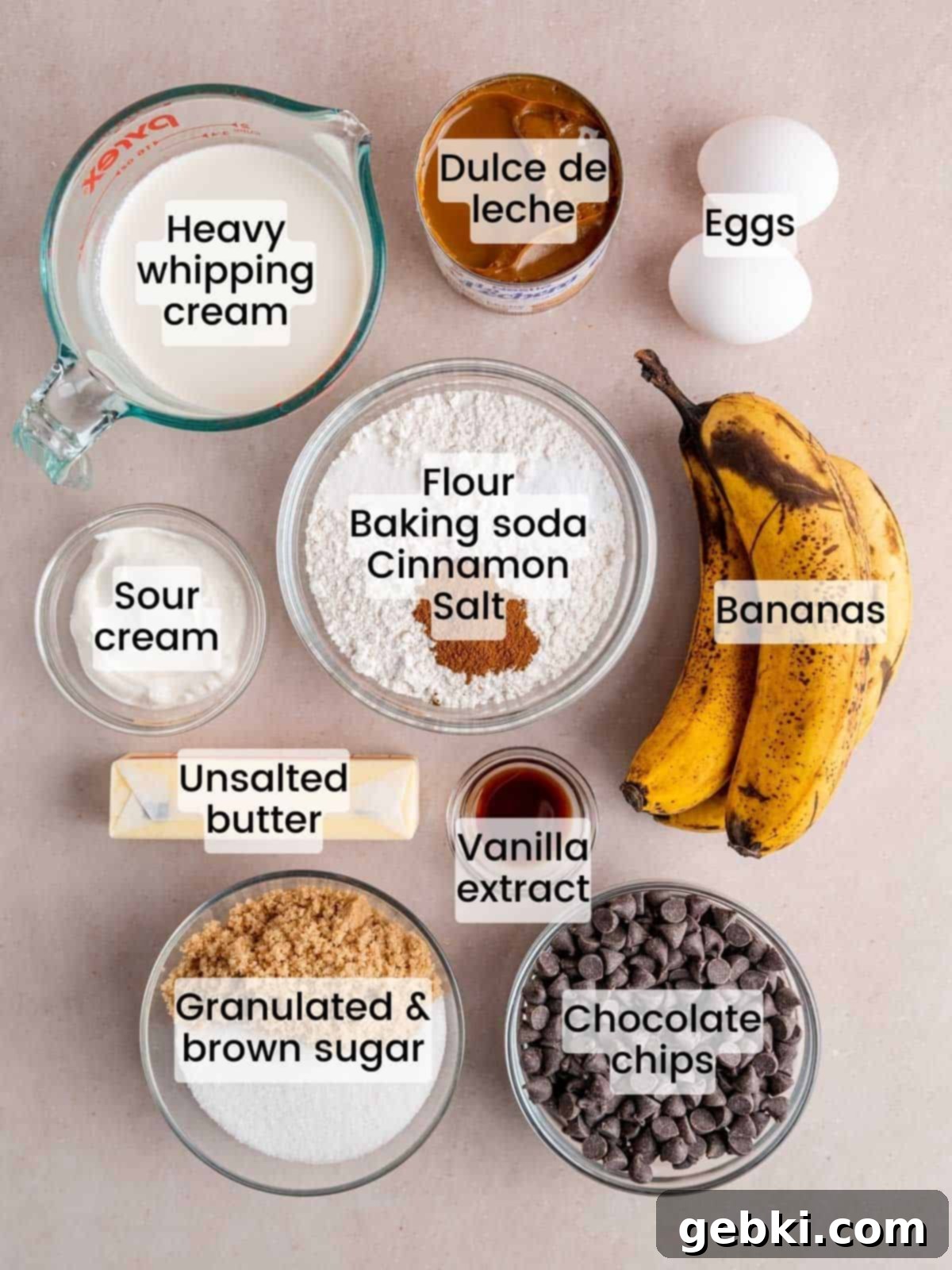 Banoffee Bliss Cupcakes 3 Ingredients laid out for making banoffee pie cupcakes, including bananas, butter, chocolate chips, and dulce de leche.