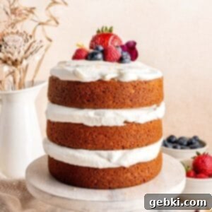Effortless Honey Vanilla Delight 11 A beautifully decorated Honey Vanilla Layer Cake with fresh berries and a honey drizzle.