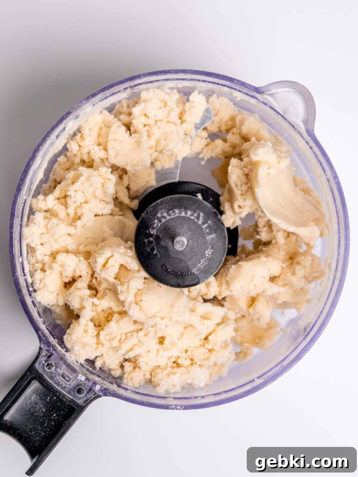Homemade pie dough in a food processor.