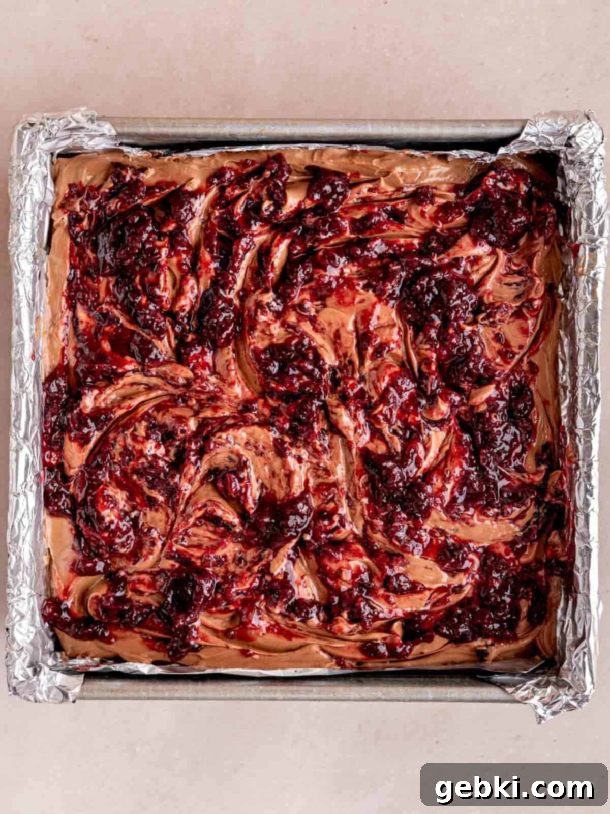No-Bake Chocolate Cherry Cheesecake 12 Cherry topping swirled over a no bake chocolate cheesecake with an Oreo crust.
