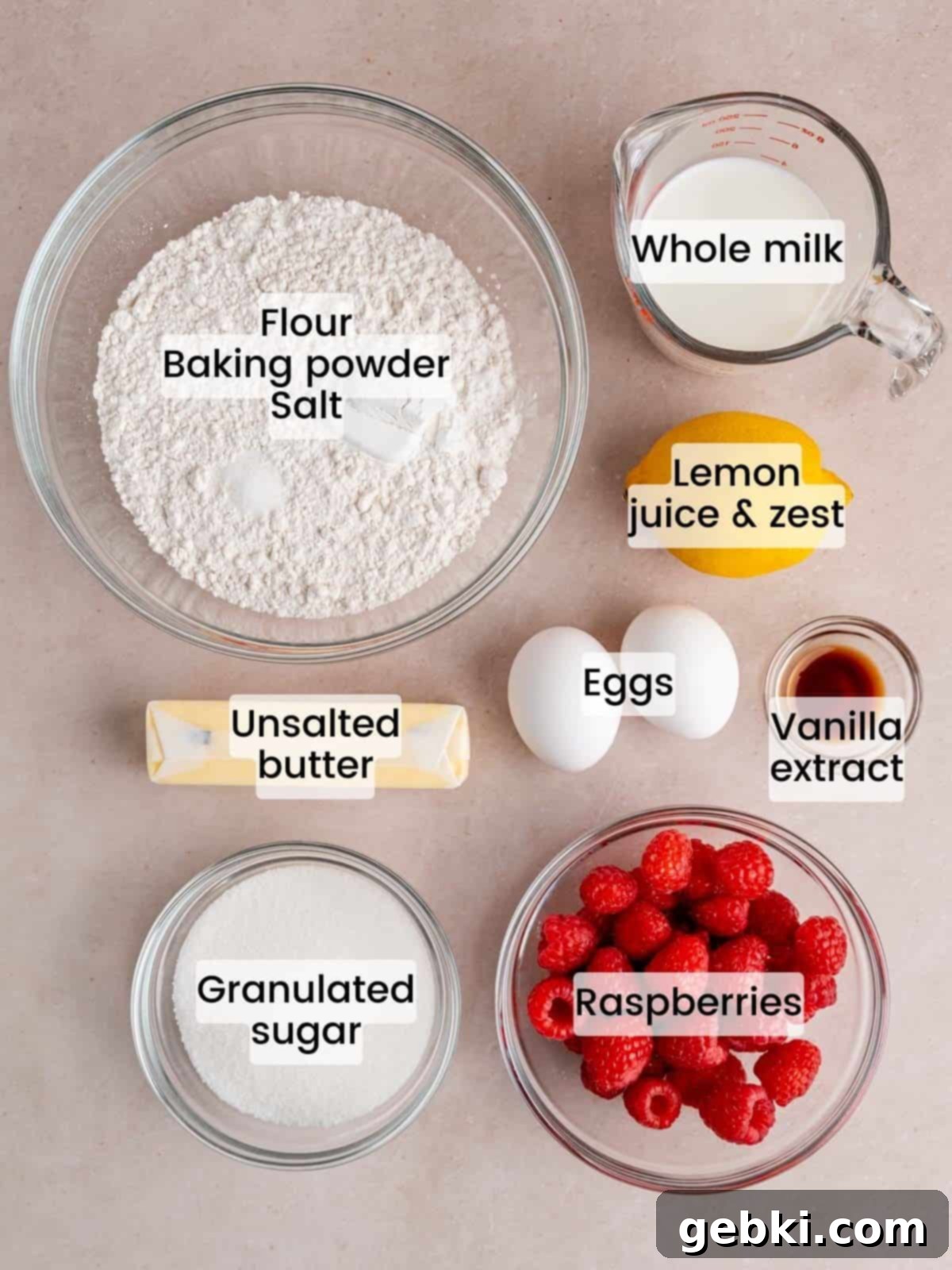 Irresistible Lemon Raspberry Muffins 2 Ingredients needed to make lemon raspberry muffins, including fresh raspberries, lemons, butter, sugar, and milk.