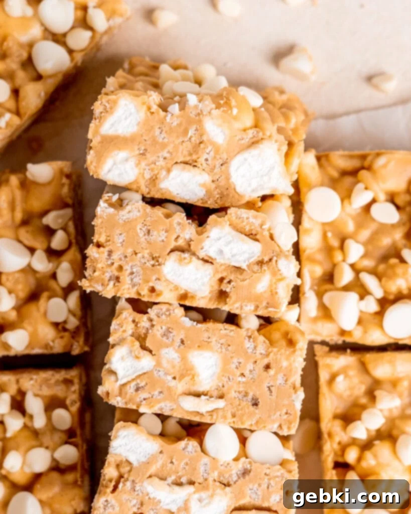 A top view of chocolate peanut butter rice krispies laying on their side so you can see the mini marshmallows and cereal inside them