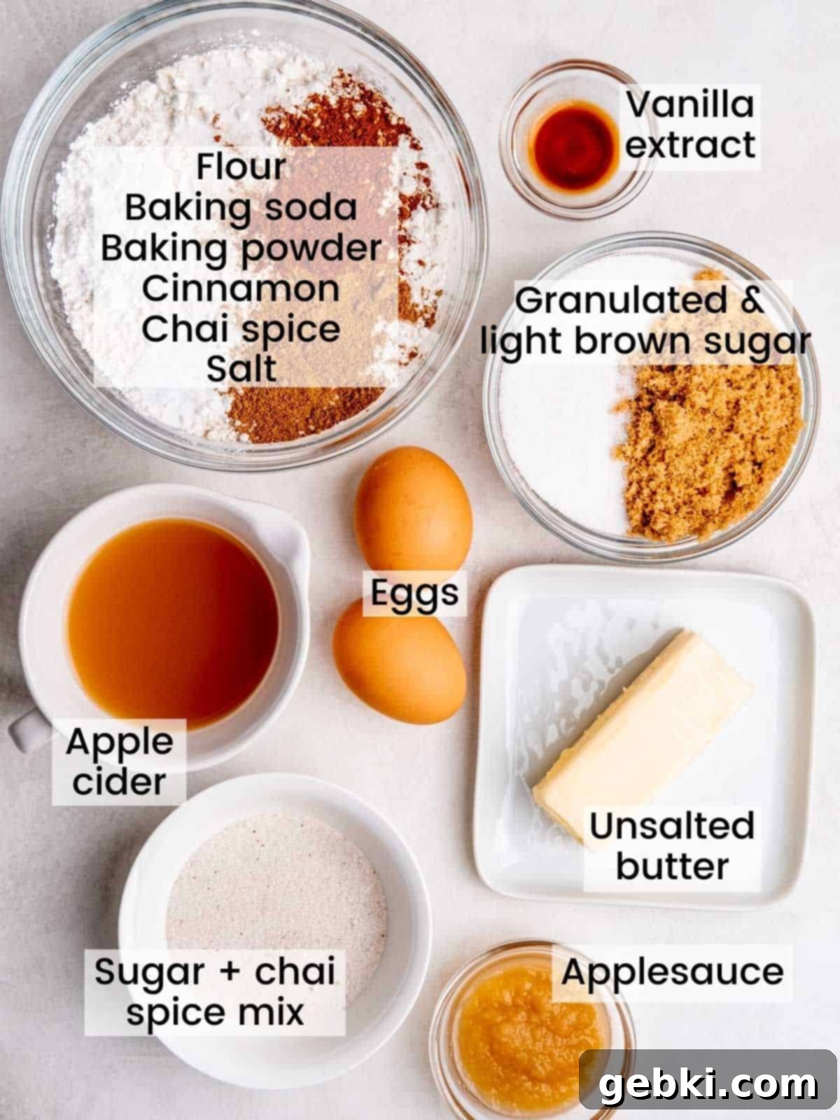 Spiced Apple Cider Loaf Cake 3 Individual ingredients for Apple Cider Donut Loaf Cake, including flour, sugars, butter, eggs, apple cider, and spices, clearly labeled for easy identification.