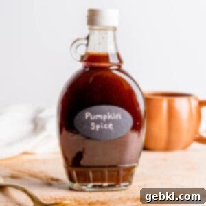 Homemade Pumpkin Spice Simple Syrup in a bottle, perfect for fall drinks.