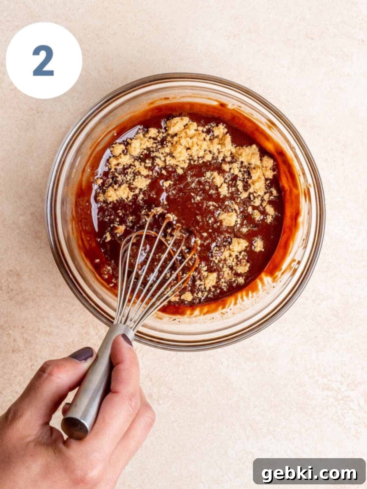 Spoonable Brownie Delight 5 Step 2: Brown sugar being stirred into the warm melted chocolate and butter mixture.