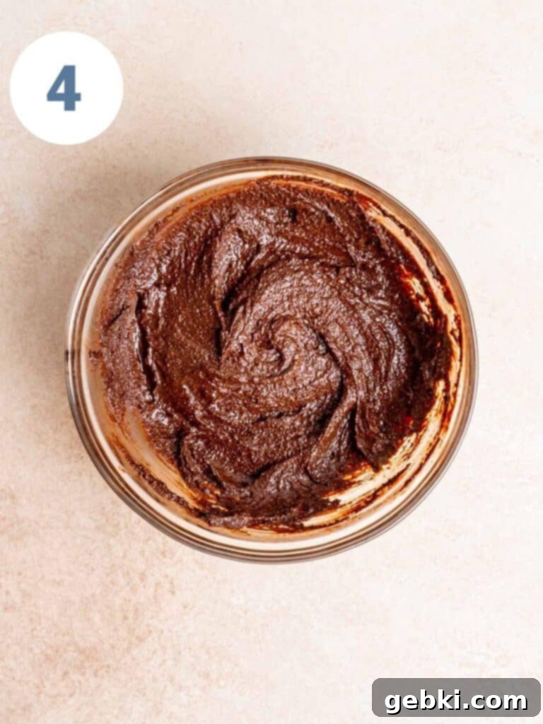 Spoonable Brownie Delight 7 The completed edible brownie batter in a bowl, showcasing its smooth, thick texture.