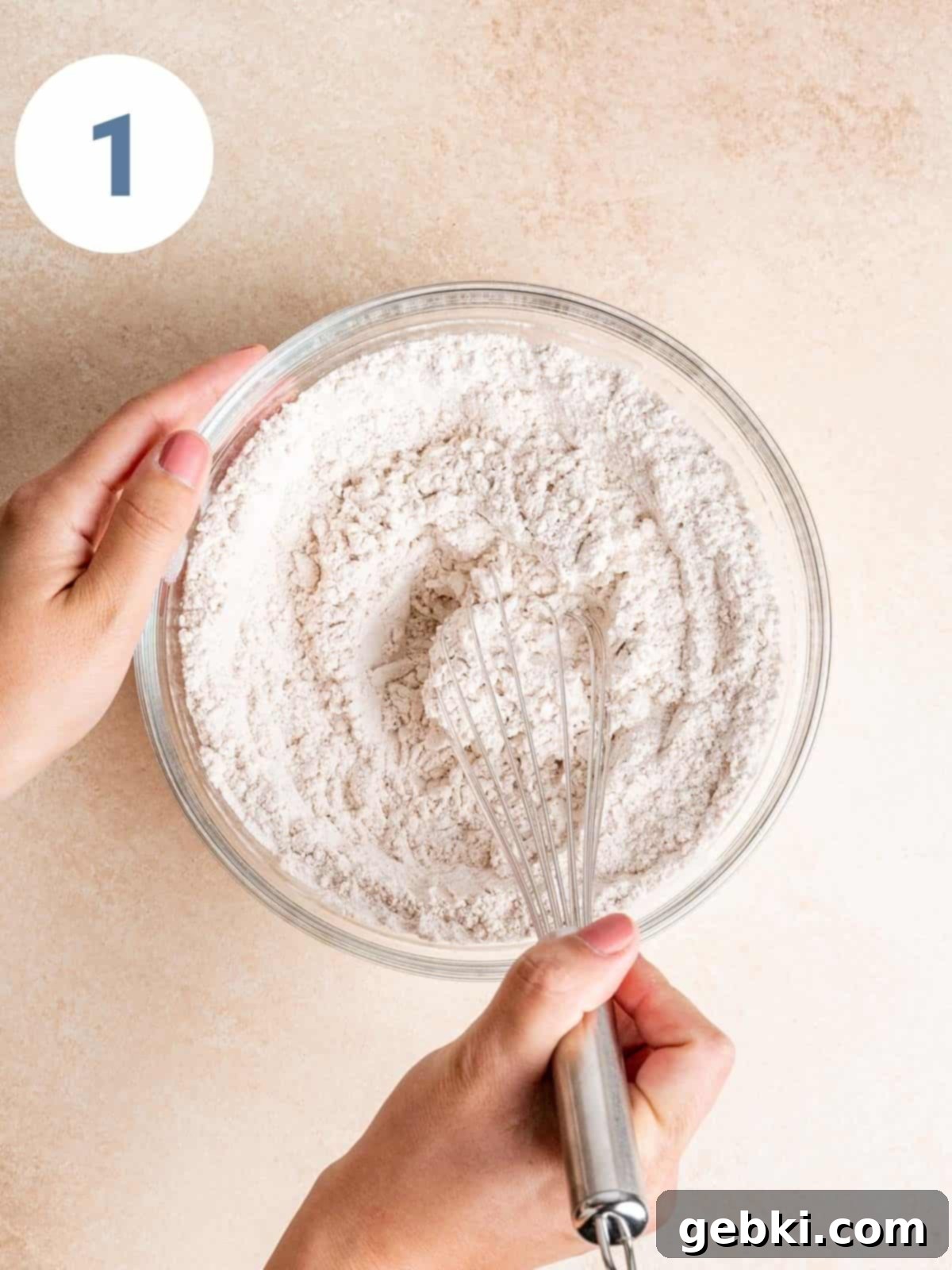 Whisking dry ingredients together.