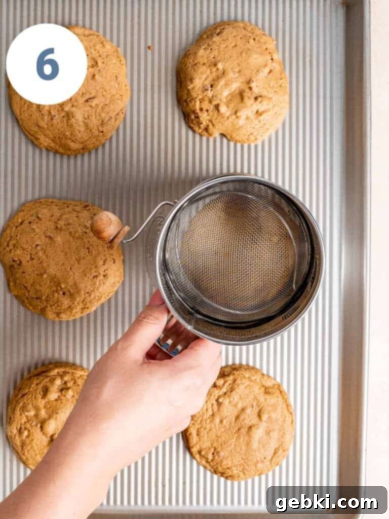 Scooting cookies into a round shape with a sifter.