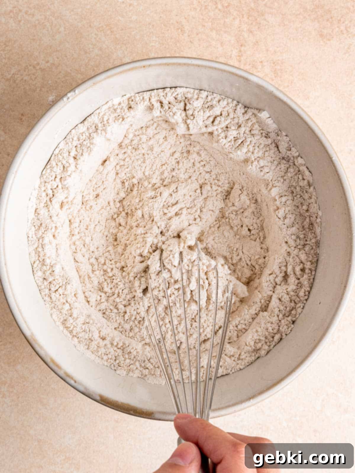 Nutty Browned Butter Snickerdoodle Cookies 5 Whisking flour, baking soda, cream of tartar, salt, cinnamon and cardamom in a bowl.