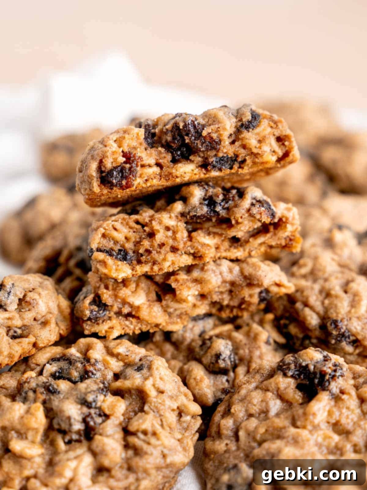 Classic Chewy Oatmeal Raisin Cookies 8 A beautiful stack of soft and chewy oatmeal raisin cookies, showing their texture.