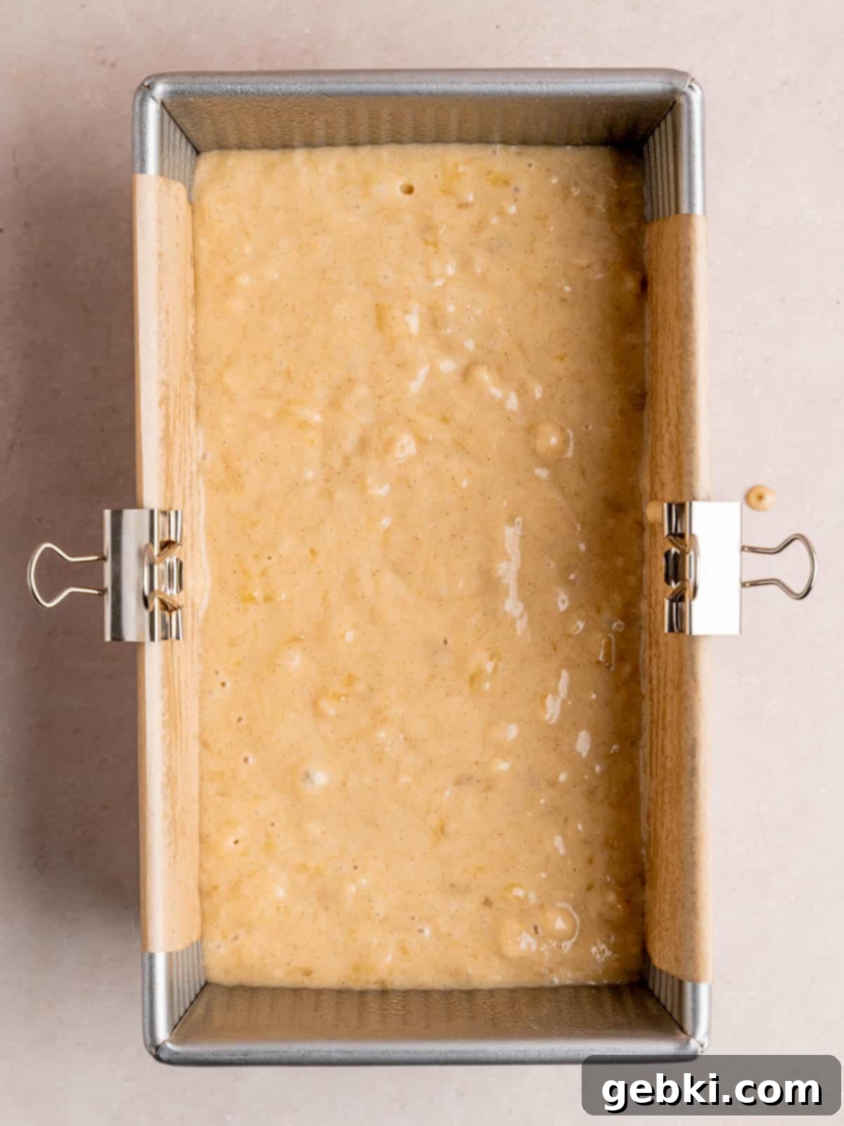 Effortless One-Bowl Banana Bread 7 A 9x5 inch loaf pan filled with banana bread batter.