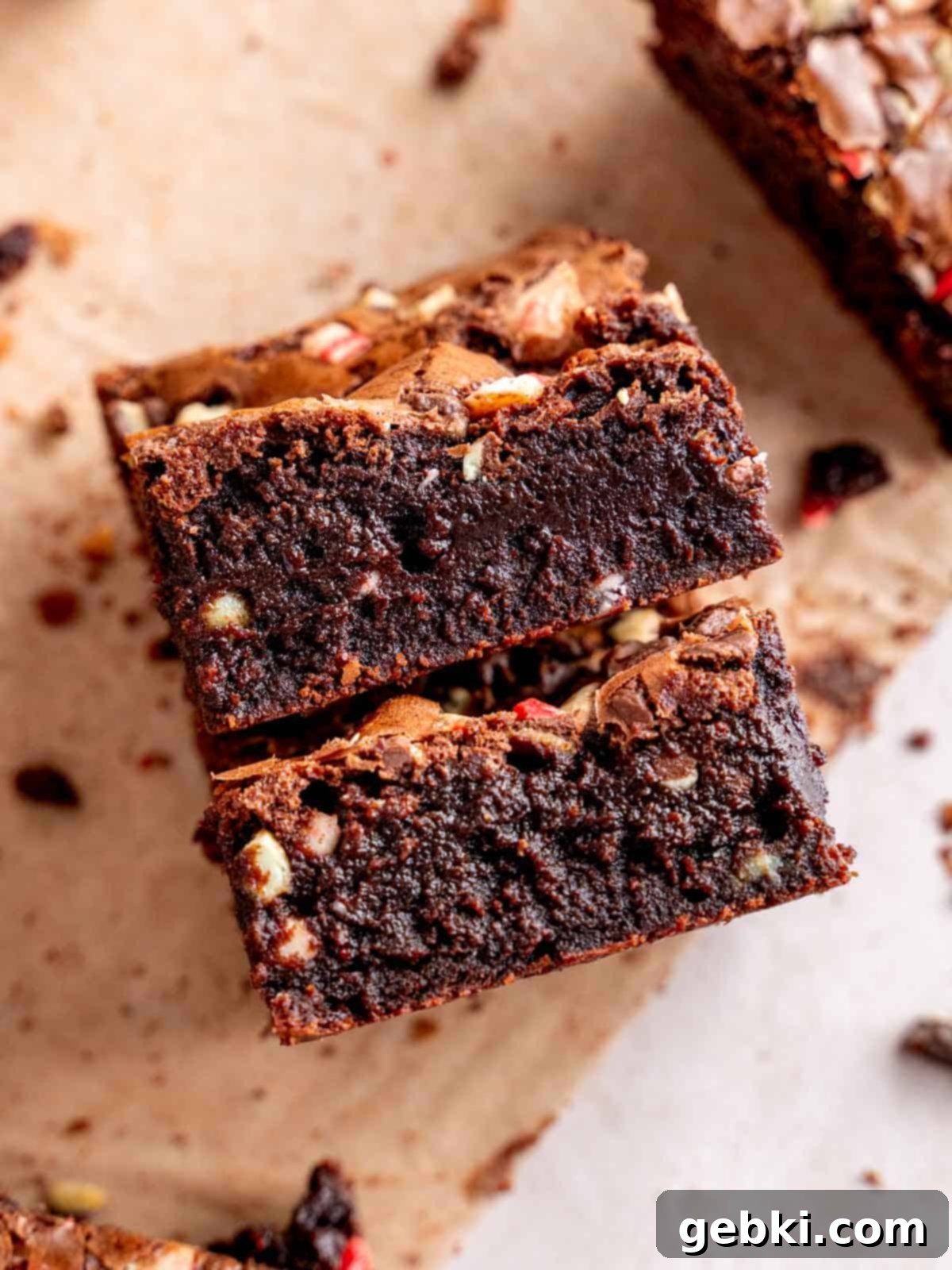 Two Andes mint brownies with gooey mint chocolate centers, showcasing their fudgy texture and embedded mint pieces.