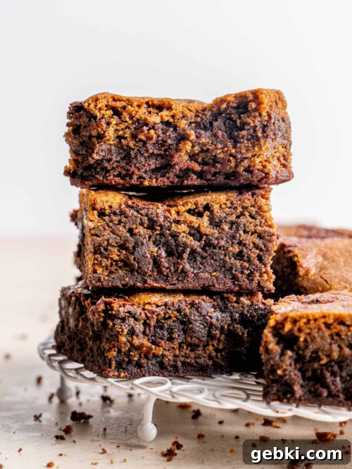Spiced Gingerbread Brownies 6 A stack of beautifully cut gingerbread brownies, showcasing the distinct layers