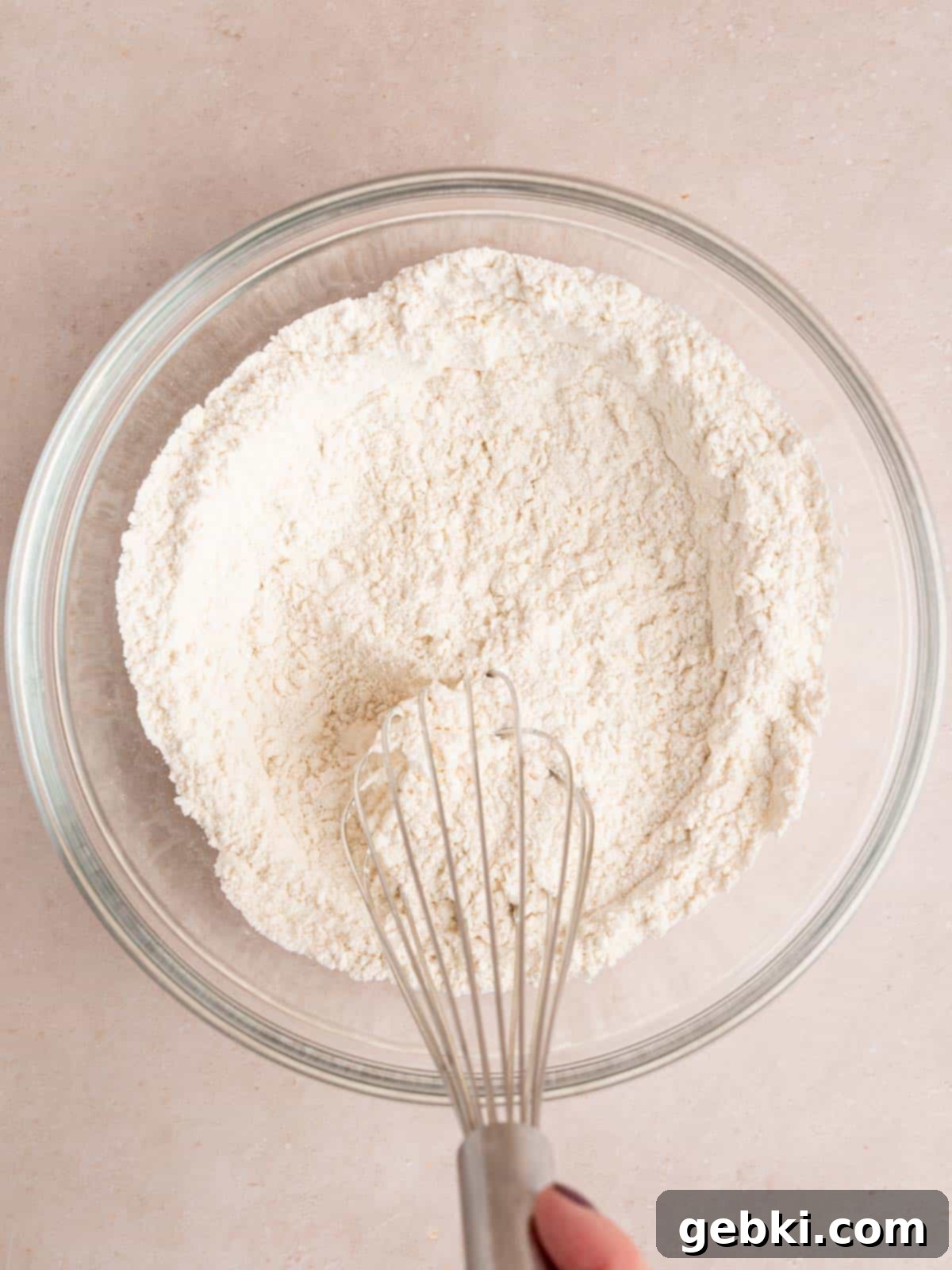 Fluffy Golden Homemade Belgian Waffles 4 Whisking all-purpose flour, baking powder, baking soda, granulated sugar, and salt together in a large mixing bowl.