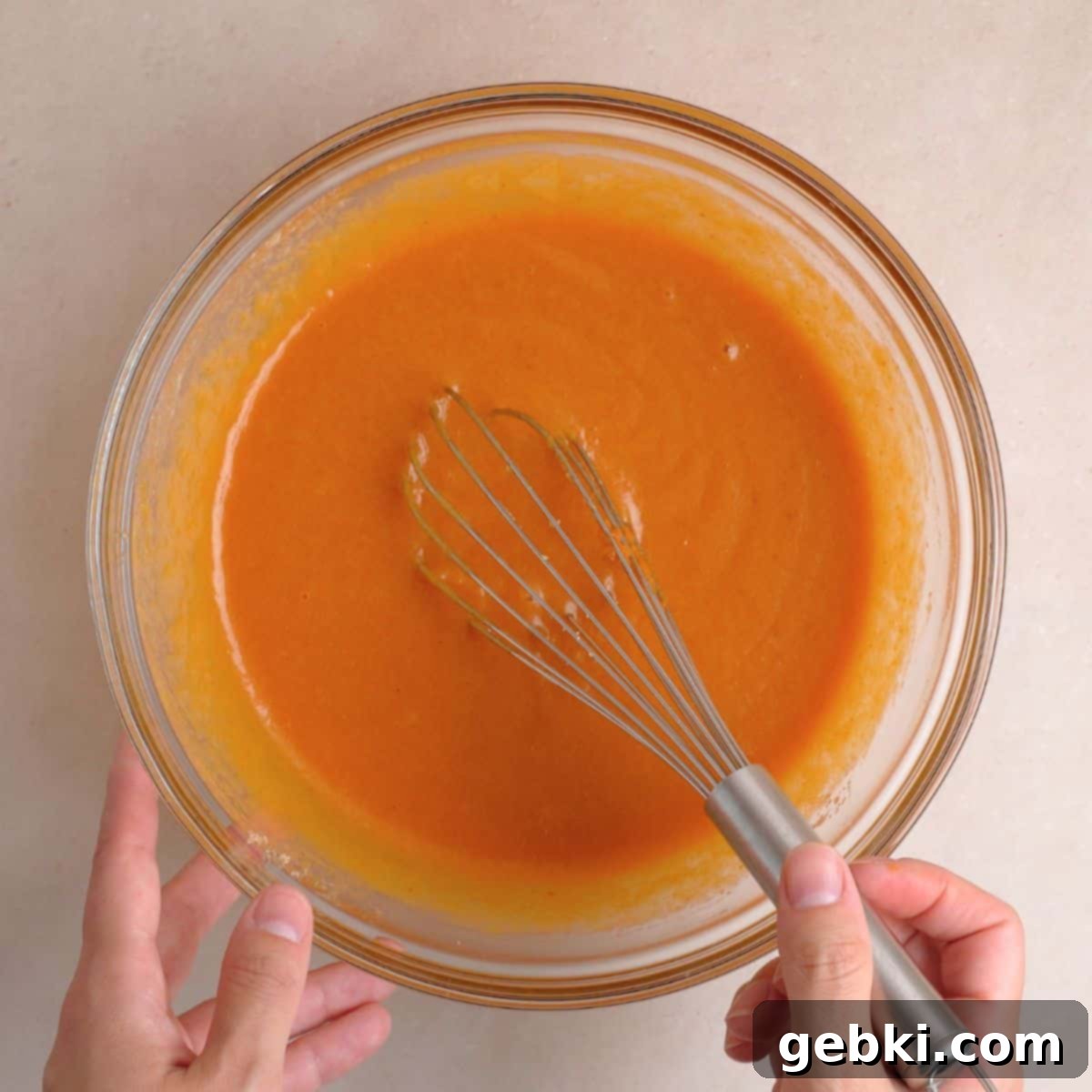 Effortless Pumpkin Oatmeal Muffins with Perfect Crumbly Streusel 6 A large bowl filled with a smooth, well-combined mixture of eggs, vegetable oil, kefir, vanilla extract, pumpkin puree, granulated sugar, and brown sugar, ready for dry ingredients.