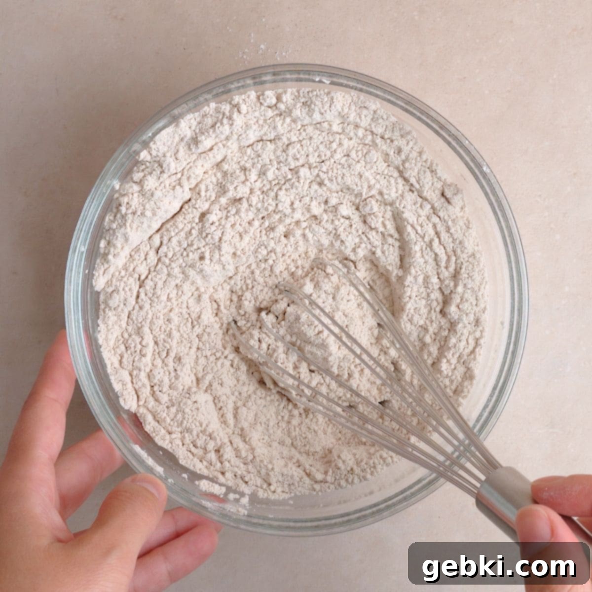 Simple Spiced Cake with Decadent Brown Butter Cream Cheese Frosting 5 Flour, baking powder, baking soda, salt, cinnamon, nutmeg, and ginger whisked together in a bowl.